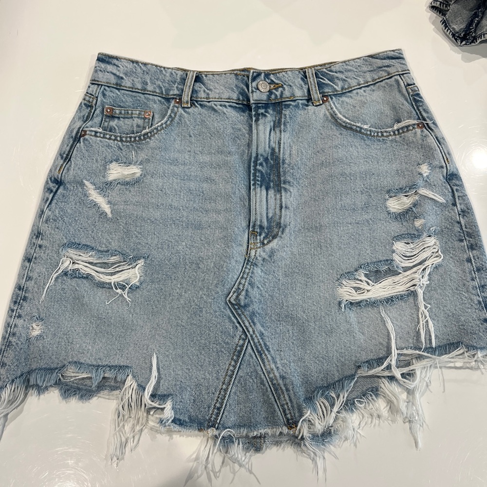 Anthropologie denim distressed skirt.